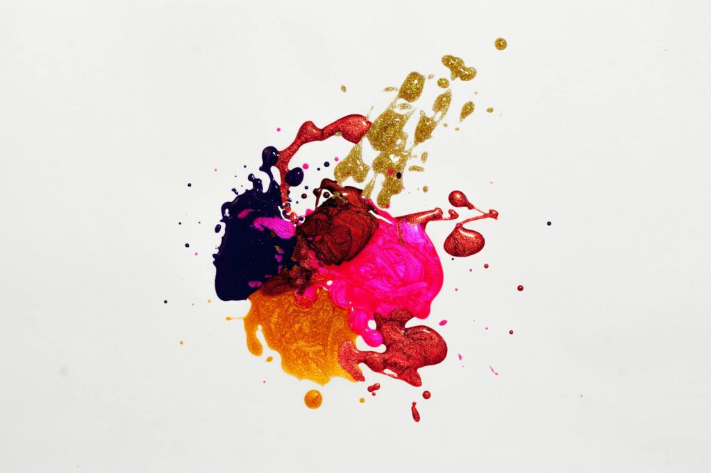 colorful splotches of paint on a white background