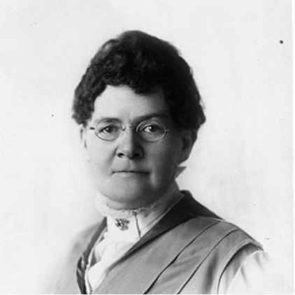Black and white photo of a woman wearing glasses