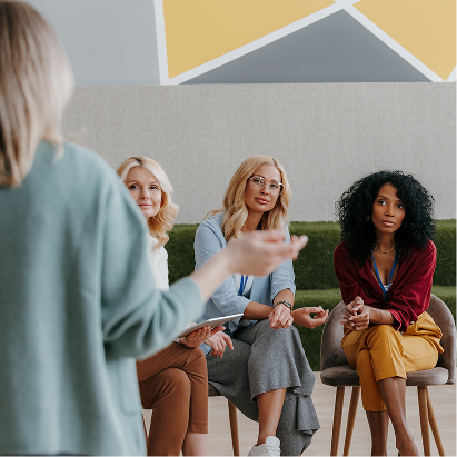A women talking to a group of other women