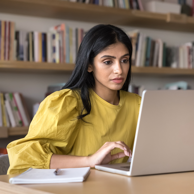 Women sitting at a desk on a laptop