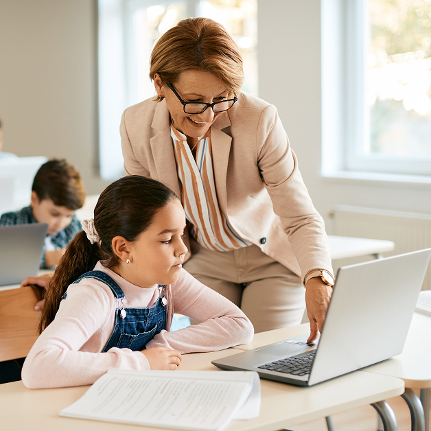 Teacher helping a student
